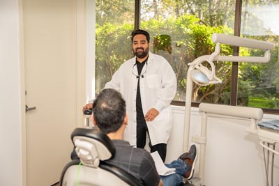 Dentist with seated patient